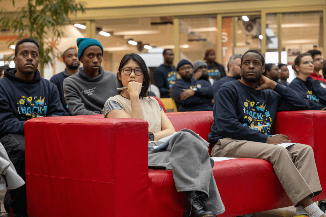 Judges Takunda Chirema and Si-Jia Wu from the UCT Financial Innovation Hub, attentively watching project presentations during the hackathon.